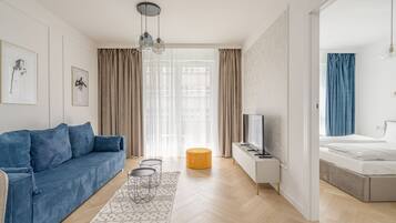 Apartamento Confort | Zona de estar | Una televisión de pantalla plana