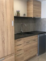 Deluxe Studio, 1 Queen Bed, Pool View | Private kitchen | Espresso maker, fridge, electric kettle, cookware/dishes/utensils