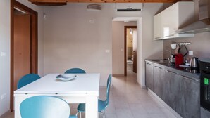 A modern kitchen with a dining area. - Luna d Argento by Wonderful Italy - Kimama (Syracuse)