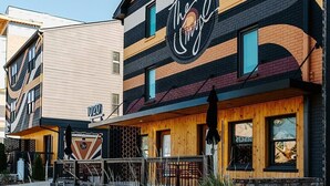 A building with a striped facade and a prominent sign reading "The Umble." - Musician's Suite: Luxe Music Row Stay, Walk to Gulch! (Nashville)