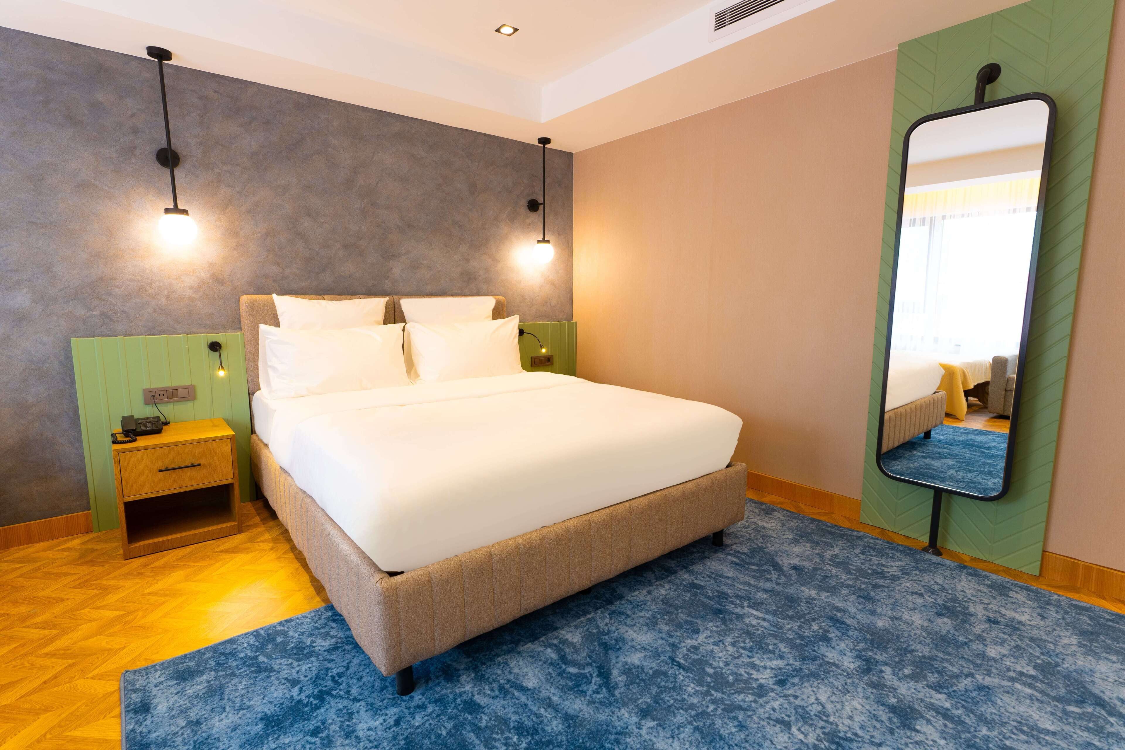 family quadruple room | premium bedding, desk, laptop workspace, iron/ironing board