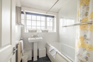 Bathtub, hair dryer, towels