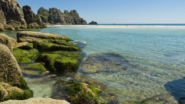 A coastal landscape with clear waters, rocky formations, and a sandy beach. - Tas Gwynn -  a house that sleeps 4 guests  in 2 bedrooms (St Buryan)