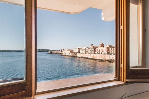 Una Finestra Su Cala Rossa by Wonderful Italy