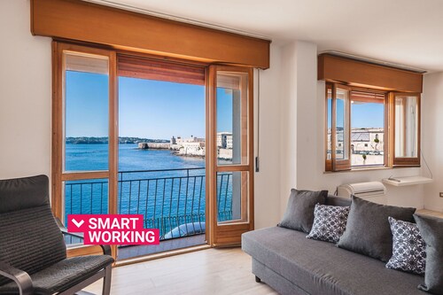 Una Finestra Su Cala Rossa by Wonderful Italy