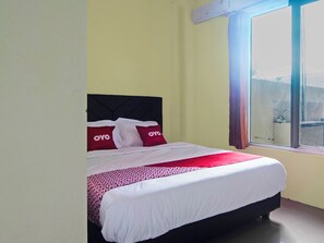 Desk, laptop workspace, bed sheets