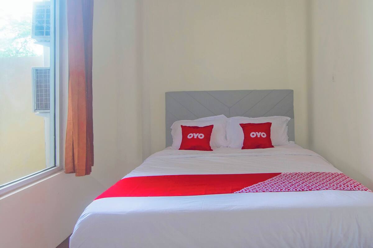 Desk, laptop workspace, bed sheets