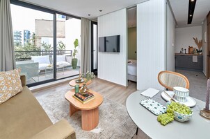 Deluxe Apartment | Living area | Smart TV