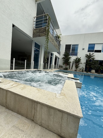 Outdoor pool, open 8:00 AM to 8:00 PM, pool umbrellas, sun loungers