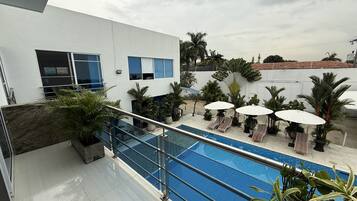 Outdoor pool, open 8:00 AM to 8:00 PM, pool umbrellas, sun loungers