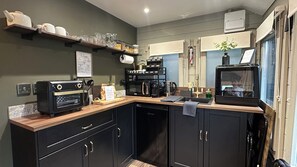 Fridge, microwave, stovetop, coffee/tea maker