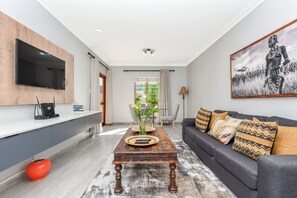 Grand Apartment | Living area | Flat-screen TV, Netflix, streaming services - Firenza 24 (Sandton)