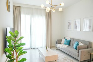 Departamento Deluxe | Área de sala de estar | Smart TV, Netflix y servicios de streaming 