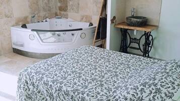 Jetted tub, hair dryer, towels, soap