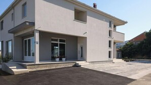 A two-story building with a flat roof, large windows, and a covered entrance area. - Apartment Franka by Interhome (Trogir)