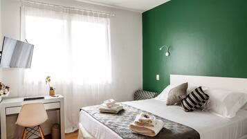 Cozy Suite at Sunset Square | Desk, free WiFi, bed sheets