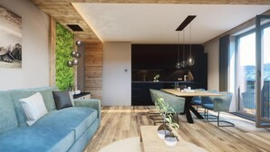 Ein modernes Wohnzimmer mit einem blauen Sofa, einem Holztisch und einem Essbereich mit Tisch und Stühlen.
