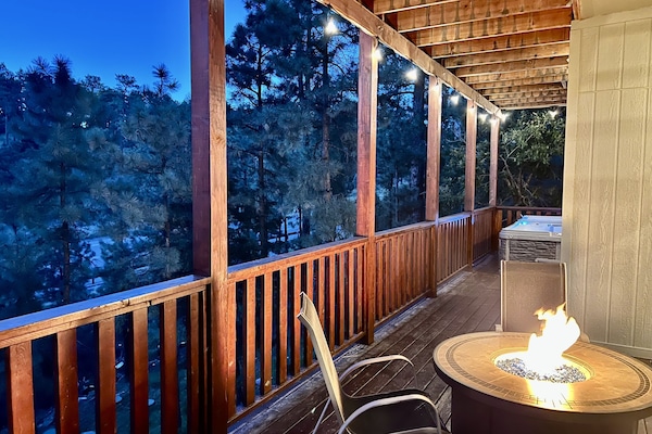 Deck with fire pit and hot tub.