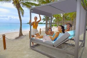 Private beach, white sand, sun loungers, beach umbrellas