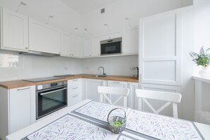 Family Apartment, 2 Bedrooms, Balcony, City View | Private kitchen | Full-size fridge, microwave, oven, stovetop