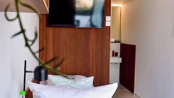 Singola Comfort | Minibar con snack e bevande gratuite, una cassaforte in camera