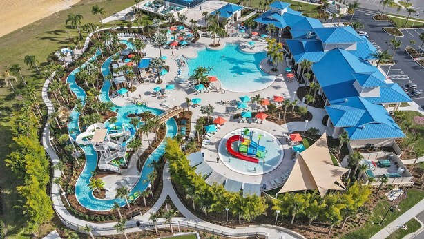 An aerial view of a resort with multiple swimming pools, water slides, and sun loungers. - Orlando Getaway: Near Disney, Pool, Resort (Davenport)