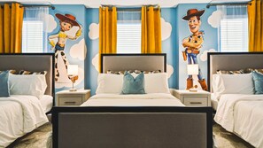 Classic design with a playful twist, featuring a large bed and two wall murals of a beloved character.