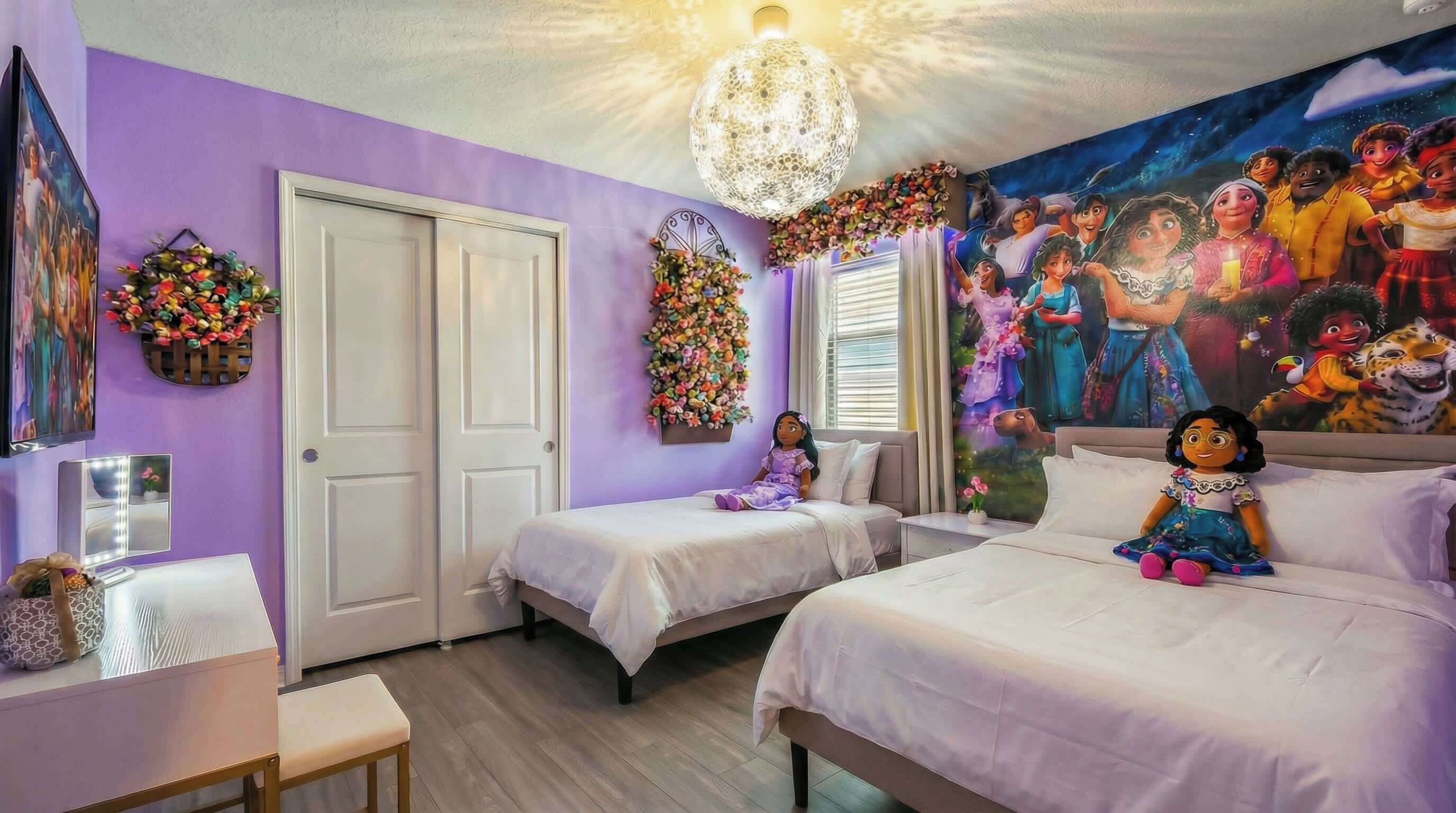 A bedroom with two beds, a vanity with a mirror, and a mural on the wall.