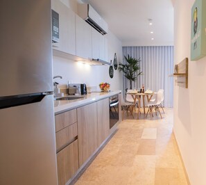 Luxury Apartment | Private kitchen | Fridge, microwave, stovetop, cookware/dishes/utensils