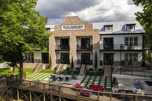 A two-story building with a sign reading 'BUCK CREEK BNB A Boutique Bed & Breakfast.'