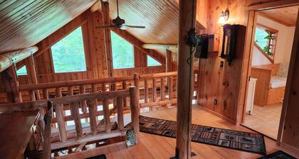 cozy lake house, full log cabin on beautiful shell lake, w/ wonderful loft.