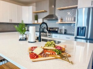 Cookware/dishes/utensils, paper towels, dining tables - Beautiful Home In Perfect Location: Private Pool, 18 Guests, Fun Kids Bunk Room (Hurricane)