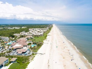 A coastal resort with beachfront properties, a long sandy beach, and a clear view of the ocean. - Gated community, private beach access, renovated condo!! (Ponte Vedra Beach)