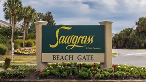 A sign for Sawgrass Beach Gate, a private community. - Gated community, private beach access, renovated condo!! (Ponte Vedra Beach)