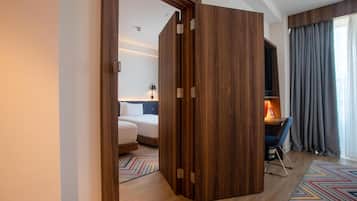 Family Room, 1 King Bed, Connecting Rooms | Premium bedding, in-room safe, blackout drapes, iron/ironing board