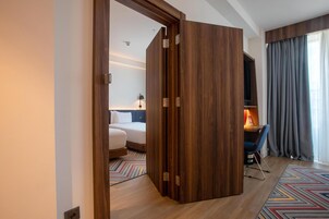 Family Room, 1 King Bed, Connecting Rooms | Premium bedding, in-room safe, blackout drapes, iron/ironing board