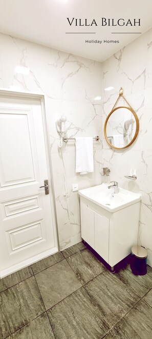 Shower, hair dryer, towels, soap