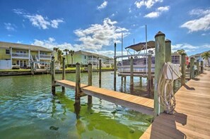 Guests can enjoy waterfront views from the hotel's two-story structure with balconies.