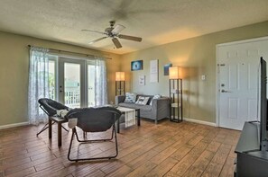 Relax in this cozy space with a sofa set, coffee table, and TV unit.