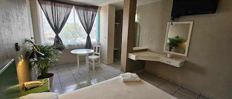 Economy Room, 1 Double Bed | Individually decorated, individually furnished, desk, laptop workspace