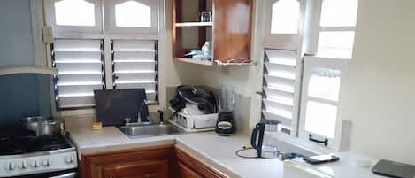 Fridge, stovetop, electric kettle, toaster