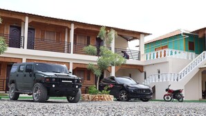 A building with a two-story structure, a balcony, and a staircase. - Increíbles junior suites 1BR (Coconuts 1) (Punta Cana)
