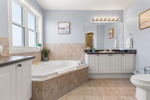 Jetted tub, hair dryer, towels, soap