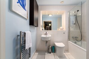 Bathtub, hair dryer, towels
