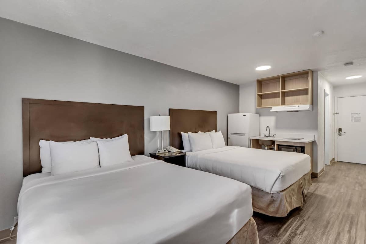 Room, 2 Queen Beds, Non Smoking | 1 bedroom, individually decorated, individually furnished, desk