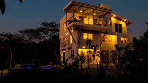 A multi-story building with balconies and a swimming pool. - OCEANVIEWS AND SHORT WALK TO PLAYA NEGRA IN GATED COMMUNITY WITH SECURITY (Los Pargos)