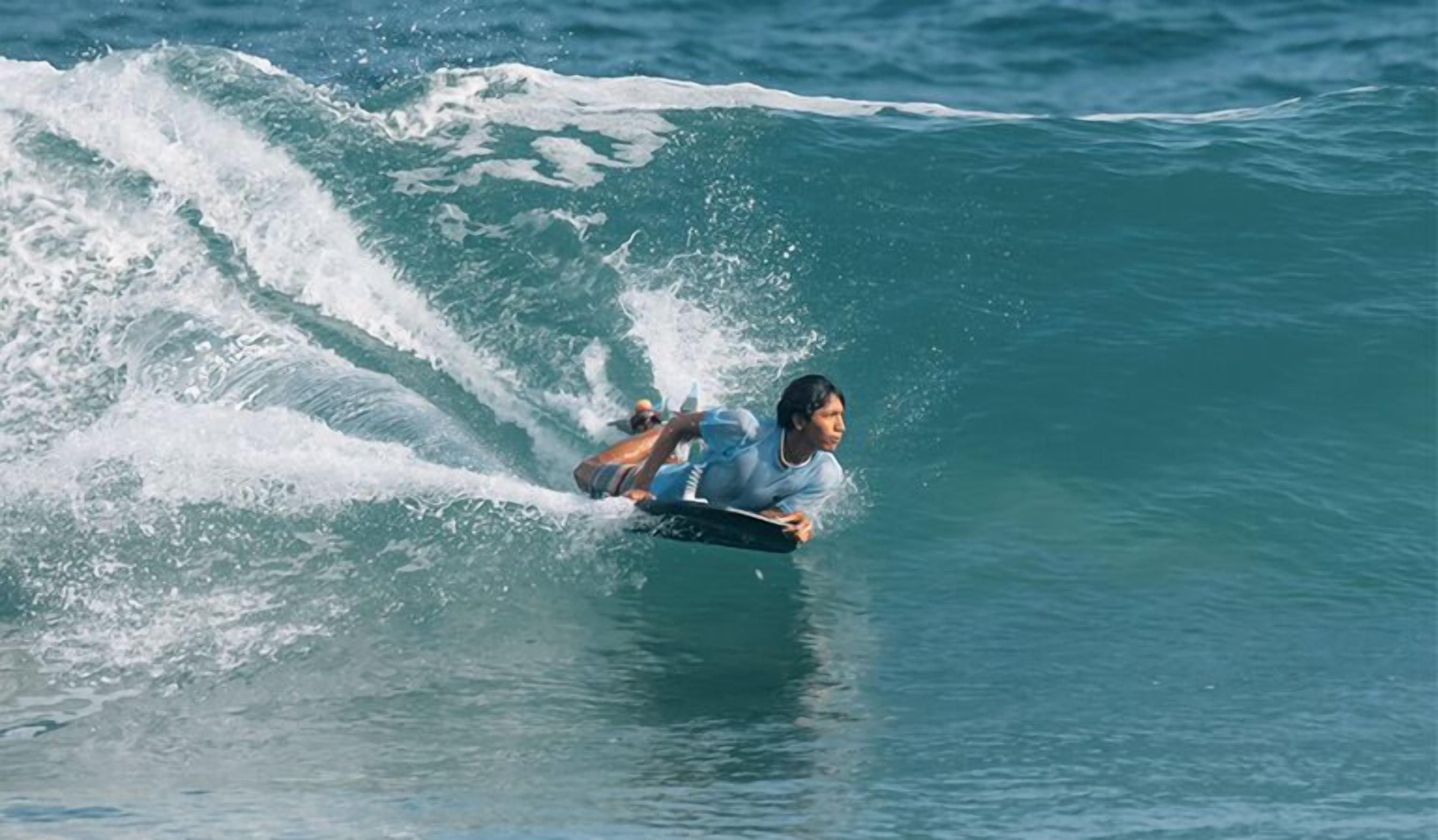 A person surfing a wave.