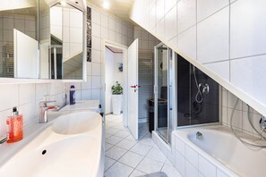 Bathtub, hair dryer, towels