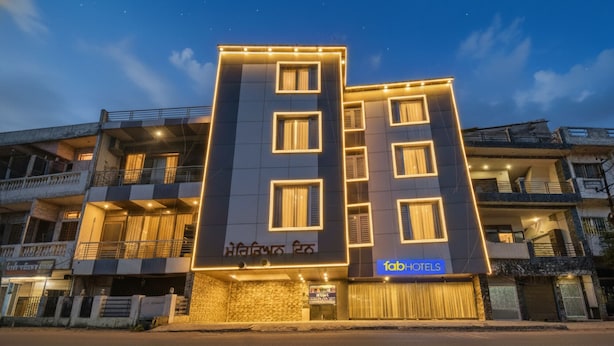 A hotel with a modern facade, multiple balconies, and a sign indicating it is a hotel. - Fabhotel Meridian Inn (Kharar)