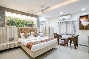 Deluxe Room | Egyptian cotton sheets, premium bedding, in-room safe, free WiFi - Fabexpress Apollo I (Ahmedabad)